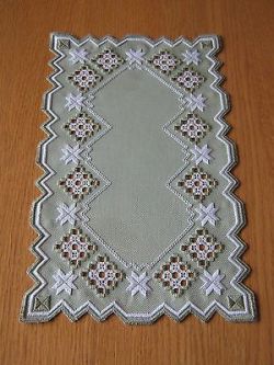 Broderie à oeillets